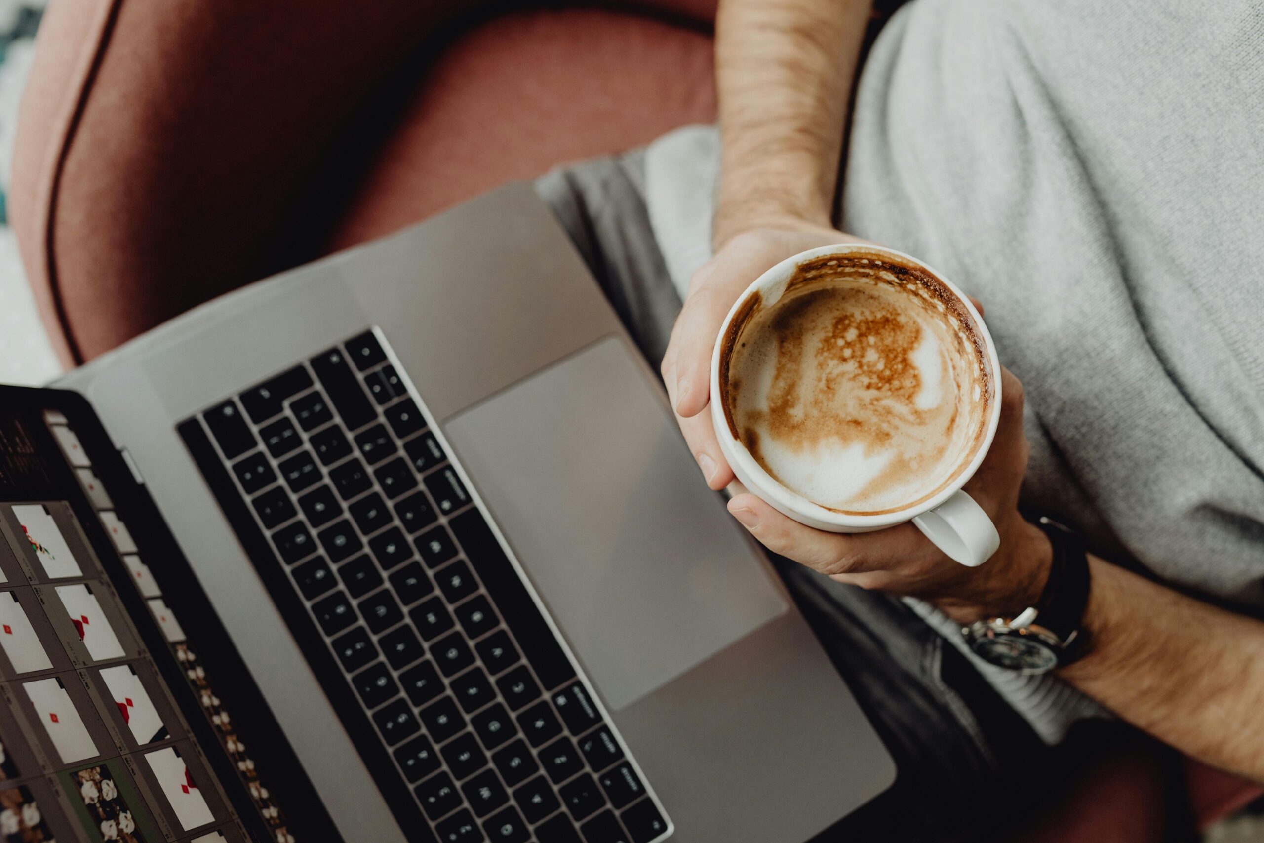 Man with Laptop on Laps and Coffee